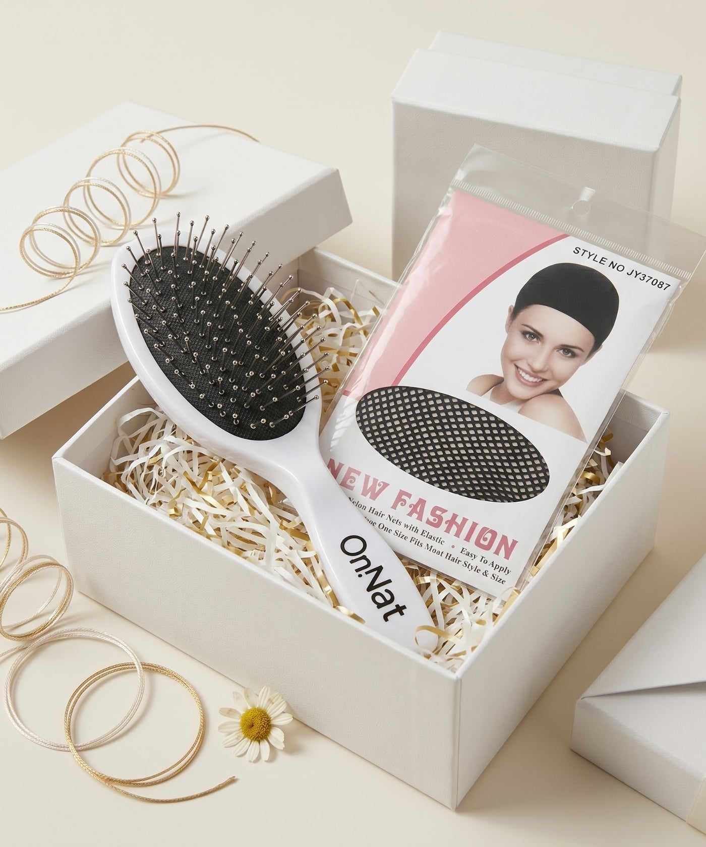 Onnat Hair presentation box with a wig brush and wig cap