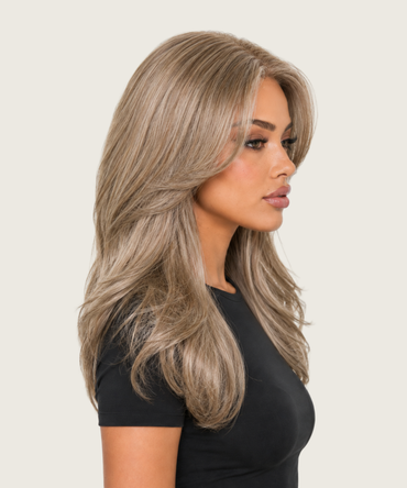 Mia champagne ash layered blowout wig shown from the side